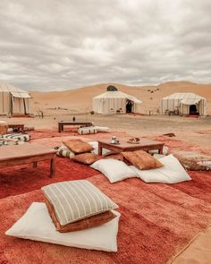 the desert is filled with tents and tables