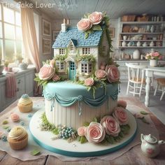 there is a cake that looks like a house with roses on it and cupcakes