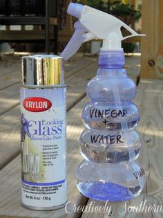 a spray bottle and some water sitting on a table