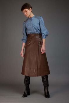 Love binetti kaia brown leather skirt    expertly crafted from a supple and rich brown leather this midi skirt is detailed with a stylish yet uncomplicated silhouette. combining modern charm with timeless sophistication this is a beautifully refined choice that you can wear for any occasion.    pivot pairings: pair with the not monday black emma cashmere sweater and loeffler randall black gia boots or the binetti red silk blouse.    details    materials:    - 100% leather    sizing and fit:    - runs true to size  - hook and eye closure  - double tie waist Brown Leather Skirt Outfit Fall, Gia Boots, Leather Skirt Outfit Fall, Brown Leather Skirt Outfit, Red Silk Blouse, Skirt Outfit Fall, Long Leather Skirt, Brown Leather Skirt, Leather Skirt Outfit