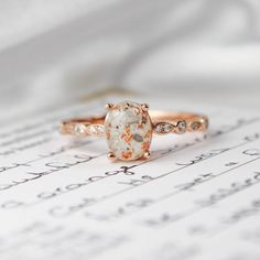 a close up of a ring on top of a sheet of paper