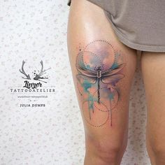 a woman's thigh with a dragonfly tattoo on her left leg and the word, tattooattiler