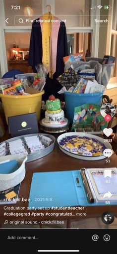 the table is full of cake and other items for someone's birthday party or special occasion