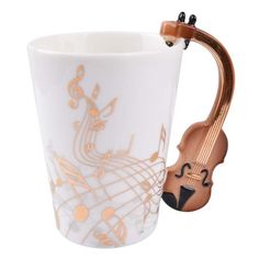 a coffee cup with a violin handle on it