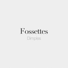 the words fossettes dimples are in black and white letters on a light gray background