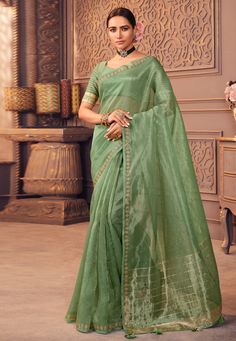 Organza Saree with blouse in Sea green colour 1207  Desc:  Color : Sea Green Fabric : Organza Work : Embroidery Wash Care : Dry clean Sleeve Style : Half Sleeve Long Sleeves : Done only in Custom Stitch Sleeves Lining : Done only in Custom Stitch Bust Size : 32 to 42 Inches Occasion : Temple Wear   Social Gathering   Pongal   Gudi Padwa   Onam   Ugadi. With Express Free Shipping and Custom Stitching, Buy Indian Party wedding wear Bridal Sarees Organza Saree with blouse in Sea green colour 1207 o