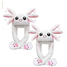 two white bunny ears with pink paws on them