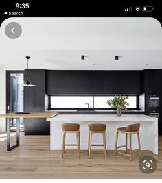 three stools are in front of the kitchen island