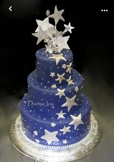 a blue and white cake with stars on it