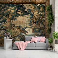 a living room with a large tapestry on the wall and a couch in front of it