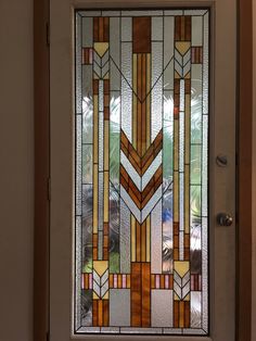 a stained glass door with an abstract design on it's side panel and bottom panel