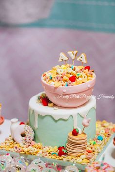 a birthday cake decorated with cereal and sprinkles