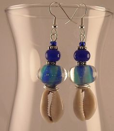 Afrocentric Glass Lampwork Beaded Cowrie by jewelrybypatsdesign Blue Large Beads Dangle Earrings, Blue Large Beaded Dangle Earrings, Blue Large Beads Drop Earrings, Blue Large Beaded Drop Earrings, Blue Beaded Drop Earrings With Large Beads, Adjustable Blue Earrings With Large Beads, Unique Blue Beaded Earrings Nickel-free, Unique Blue Beaded Nickel-free Earrings, Blue Czech Glass Beach Jewelry