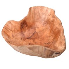 a large wooden bowl sitting on top of a white surface