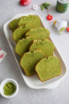 several pieces of green bread on a white platter