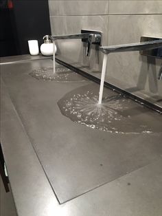 the bathroom sink is leaking water from the faucet