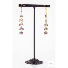 These pretty Purple Glass Fringe Twist Earrings are so fun, and unique! The pretty purple faceted glass beads are complemented by gold-plated Figaro chain. Gold-plated sterling silver lever backs. They are 2 inches long! These dangle earrings are lightweight and lovely! They have a charming little twist in how they dangle!Perfect for adding a touch of girly color and sparkle to any outfit. They are sure to become one of your favorites! Elegant Lavender Beaded Drop Earrings, Purple Metal Chandelier Earrings For Gifts, Purple Metal Chandelier Earrings As Gift, Elegant Lavender Beaded Earrings With Dangling Beads, Purple Dangling Beads Jewelry For Party, Gold Amethyst Long Drop Earrings, Purple Metal Beaded Drop Earrings, Purple Dangle Earrings With Beads, Lavender Earrings With Dangling Beads For Gifts