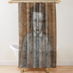 a shower curtain with a drawing of a woman's face and hands on it