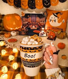 a table topped with lots of halloween decorations