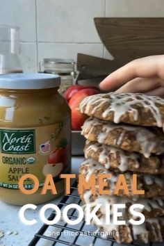 there is a stack of oatmeal cookies next to a jar of peanut butter