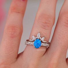 Gorgeous Blue Fire Opal Ring Set ►Made of solid sterling silver with rhodium finish (925) ►Accented With Simulated Diamonds (CZ) ►Sold as set ►October birthstone Center Stone: Opal Color: Blue Stone cut: Oval Gem size: 8.0x 6.0 mm Average Carat Weight: 1.3 ct. Gemstone creation: Lab-Created ✓ 100% Nickel-Free ✓ Hypoallergenic ✓ Comfort Fit ✓ Free Ring Box ✓ Free USA Shipping ✓ Ready to ship next business day *All listing photos and ring design are subject to copyright. *All rights reserved. © 20 Oval Solitaire Stackable Rings For Anniversary, Oval Solitaire Stackable Rings For Wedding, Blue Fire Opal, Sterling Silver Rings Set, Fire Opal Ring, Silver Ring Set, Opal Engagement, Engagement Rings Opal, Opal Color