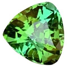 GEMSTONE TYPE: Natural Tourmaline PIECE(S): 1 WEIGHT: 2.25 Carats SHAPE: Trillion Cut SIZE (MM): 7.97 x 8.26 x 5.86 COLOR: Green CLARITY: Approx Eye Clean TREATMENT: None ORIGIN: Afghanistan CERTIFICATE: On demand (if you require a certificate, kindly request it before proceeding with the payment) Introducing an exquisite gemstone that embodies the natural splendor and craftsmanship synonymous with Afghan minerals. This 2.25 carat trillion cut green tourmaline is a remarkable piece sourced direc Trillion Cut Ring, Cushion Cut Ring, Tourmaline Stone, Bluish Green, Ring Pendant, Tourmaline Gemstone, Stone Cuts, Green Tourmaline, Modern Jewelry