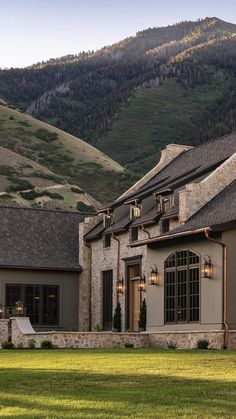 an image of a house with mountains in the background