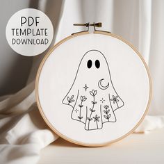 a cross stitch pattern with a ghost on it