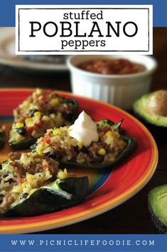 stuffed poblano peppers on a plate with salsa and avocado