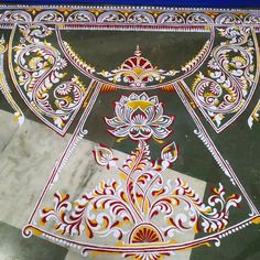 an intricately decorated floor with white and red designs