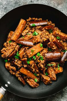 cooked eggplant and ground beef in a skillet