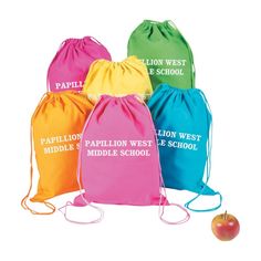 four drawsacks with the words papillion west middle school and an apple