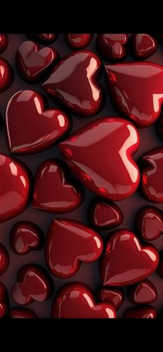 many red hearts floating in the air on top of each other, with black background