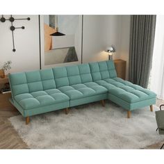 a living room with a blue sectional couch