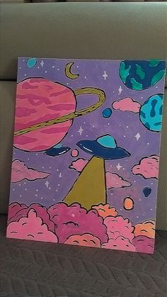 an image of a painting that is on the ground with clouds and planets in the background