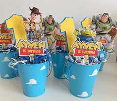 toy story birthday centerpieces in blue pails