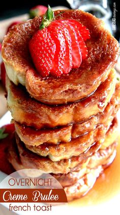 a stack of french toast with strawberries on top and the words overnight creme brule