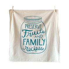 a tea towel hanging on the wall with preserve fruits and family recipes printed on it