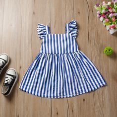 Playful Striped Summer Dresses, Blue Sleeveless Dress For Beach, Striped Cotton Sundress For The Beach, Sleeveless Striped Beach Dress, Playful Blue Sleeveless Summer Dress, Sleeveless Vertical Striped Summer Dresses, Blue Cotton Dress With Vertical Stripes, Casual Sleeveless Dress With Vertical Stripes, Striped Cotton Summer Sundress