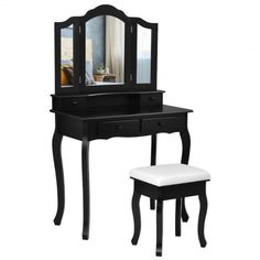 a black vanity with mirror and stool