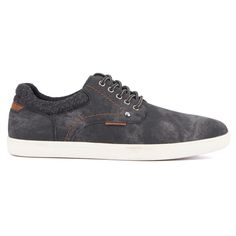 The Dan lace-up sneaker combines rugged style with ultimate comfort. Its waxy distressed upper material gives a unique, vintage look, while the mesh lining ensures breathability for all-day wear. A padded collar enhances comfort, providing extra cushioning with each step. Perfectly balancing durability and sophistication, the Dan sneaker is versatile enough for both casual and semi-formal occasions. Elevate your everyday look with this blend of classic design and modern comfort, making it a must Black Lace-up Sneakers For Urban Adventures, Rugged Lace-up Sneakers With Textured Sole, Rugged Black Low-top Sneakers, Rugged Sneakers With Round Toe, Rugged Sneakers With Laces And Round Toe, Rugged Low-top Sneakers With Textured Sole, Black Outdoor Sneakers With Perforated Toe Box, Rugged Low-top Sneakers For Streetwear, Rugged Low-top Streetwear Sneakers