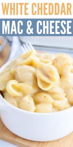 white cheddar mac and cheese in a bowl with a fork on the side