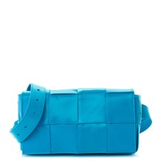 This is an authentic BOTTEGA VENETA Paper Calfskin Intrecciato Cassette Belt Bag in Pool. This stylish messenger bags crafted of tightly woven intrecciato blue leather. The bag features a matching adjustable belt strap and a front flap. The flap opens to a leather interior with a hanging  pocket. Blue Rectangular Bag With Intrecciato Weave, Designer Rectangular Shoulder Bag With Intrecciato Weave, Rectangular Intrecciato Weave Shoulder Bag For Travel, Rectangular Woven Leather Bag, Square Shoulder Bag With Intrecciato Weave, Cassette Bag Bottega, Bottega Veneta Cassette Bag, Bottega Veneta Crossbody Bag, Bottega Veneta Cassette