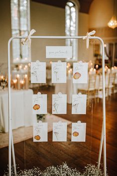 the seating cards were placed on a clear acrylic stand for guests to sit in