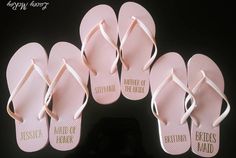 six pairs of pink flip flops with the words bridesmaid written on them