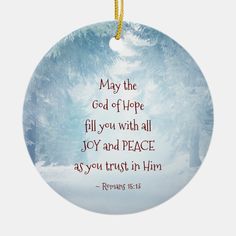 a christmas ornament with an image of trees and the words, may the god of hope fill you with all joy and peace as you trust in him