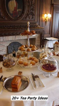 a table topped with lots of pastries and desserts