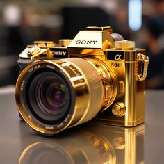 a gold camera sitting on top of a table