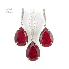 "Brighten up your mood instantly with this elegant and sparkly Swarovski Dark Red Jewelry Set! These dazzling fancy crystals are designed with incredible facets that produce the famous Swarovski sparkle. Earrings and Necklace Jewelry Set made with: - the gorgeous and Genuine 18x13mm Siam Swarovski teardrop pear shaped fancy stones, set in sterling silver plated settings - Hypoallergenic Rhodium plated rhinestone ear hooks - the earrings are about 1 1/2\" top of the ear wire to bottom of the ston Red Crystal Earrings For Gift, Red Crystal Jewelry With Matching Earrings, Red Crystal Drop Earrings, Glamorous Red Jewelry With Sparkling Stones, Red Bling Jewelry For Evening, Red Sparkly Jewelry For Formal Occasions, Formal Red Sparkling Jewelry, Red Crystal Formal Earrings, Red Rhinestone Jewelry For Evening