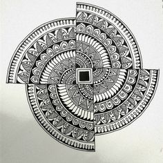 a black and white drawing of a circular object with intricate designs on the side,